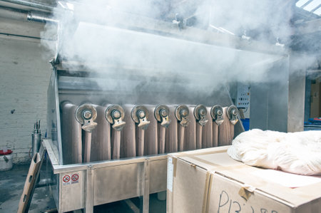 Kent, uk 01.01.2023 A industrial dyeing machine, raw cotton dye hot heat dip dyeing cotton into various colours for the textile and fashion industry. Raw cotton getting preparedのeditorial素材