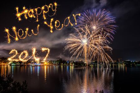 Happy new year 2017 written with firework on firework backgroundの写真素材