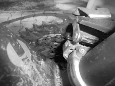 Blackwhite image - Mud covered three speed chainset with dirty gears in detailed view.の写真素材