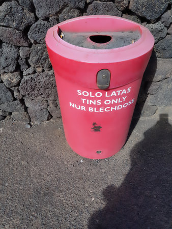 Red Recycling Bin on the Lava Coast in Canary Islandsの写真素材