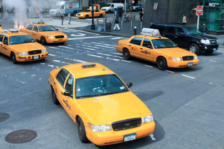 New York yellow taxis working their way through the Manhattan streets のeditorial素材