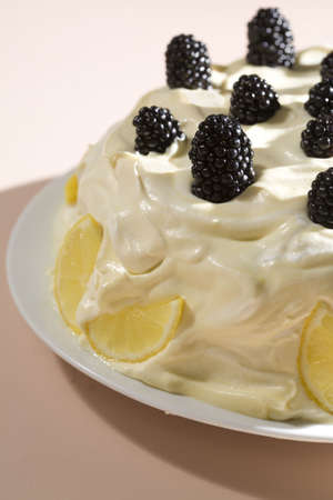 Lemon Cake topped with sweet frosting and fresh blackberries. Photographed with Canon 5D for optimum quality.の写真素材