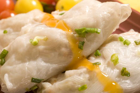 Macro of California Spring Rolls topped with a spicy mango sauce and chopped chives.の写真素材