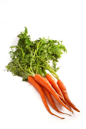 Ripe Organic Carrots over white background. Plenty of copy space.の写真素材