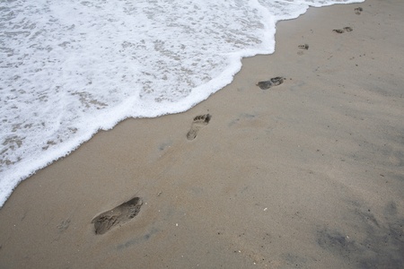 Footprints in the Sand photo. Great for Beach Vacation concepts, and journey abstract.
