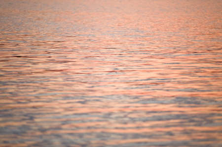 Red gold waves by sunsetの写真素材