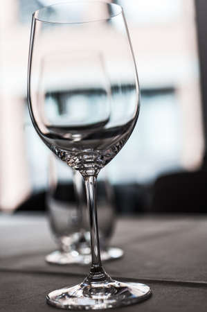 Two glasses in a row on a table の写真素材