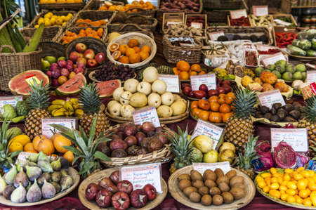 Market stall with exotic fruitsの写真素材