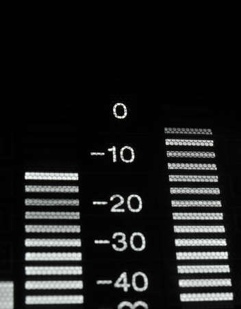Perspective macro shot of the equalizer display of the professional hdcam video player. Shallow dof. Visible data: sound scale, waves, decibels, digits.の写真素材