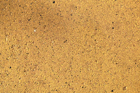 Background of yellow stone wall texture patternの写真素材