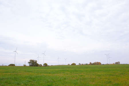 Wide shot of the wind turbines in the field の写真素材
