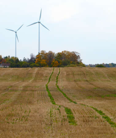 Two wind turbines in the field  Green energy の写真素材