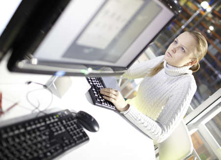 Young girl is choosing the tablet pc in the online store の写真素材