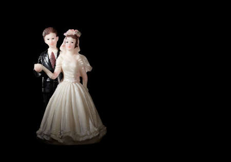 Wedding cake figurines on black 