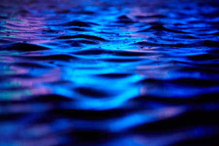Deep blue water surface with dark waves の写真素材