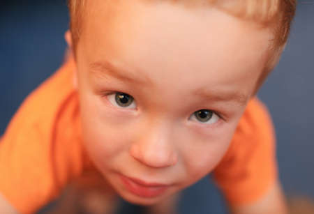 Close up portrait of 3 year-old boy shot from high angleの写真素材