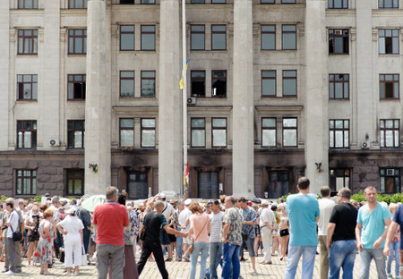 ODESSA, UKRAINE - JUNE 8, 2014: Memorial service near the burnt Trade Unions House in Odessa. Ceremony devoted to the people who died in clashes on 2 May 2014のeditorial素材