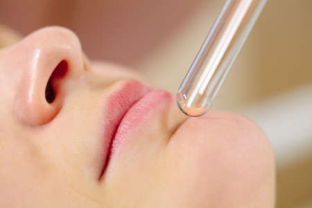 Macro shot of woman under laser impact on problem areas on skin