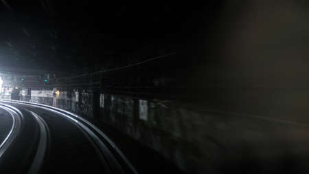 First person window perspective view of underground Paris subway express moving fast with blue and yellow lightの写真素材