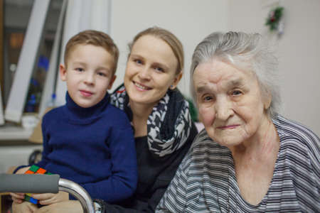 An everyday portrait of a young woman, her son and her grandmother