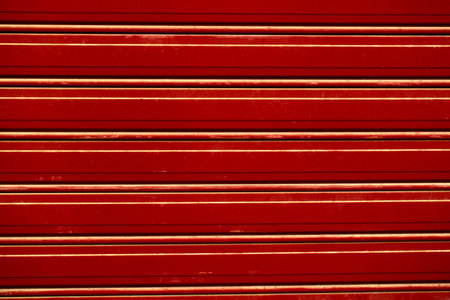 Background texture of decorative natural brown wood panelling with carved mouldings in a repeat pattern in a full frame view. This is a lighter versionの写真素材