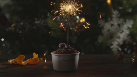 Crumble dessert with sparkler in the spirit of Christmasの写真素材