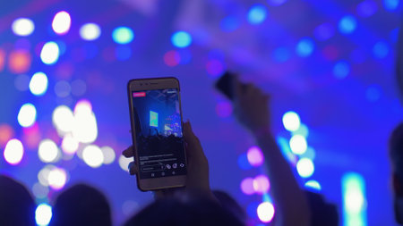 Cellphone recording video during a live concertの写真素材