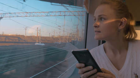 In Saint-Petersburg, Russia in train rides young girl and looking out the window