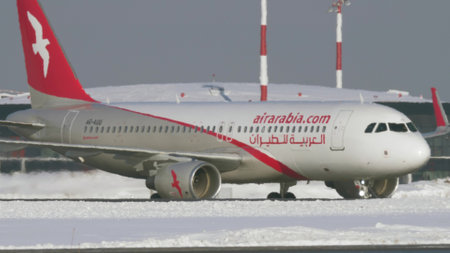 Air Arabia aircraft taxiing at Sheremetyevo Airport in Moscow. Winter viewのeditorial素材