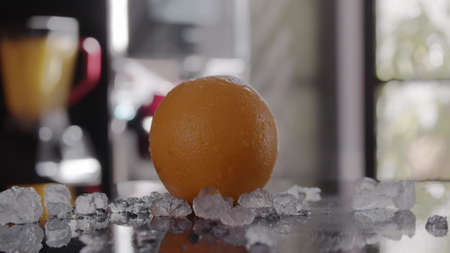 An orange in iceの写真素材