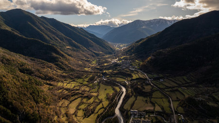 Aerial view of the ara river winding through the picturesque broto valley, nestled in the heart of...