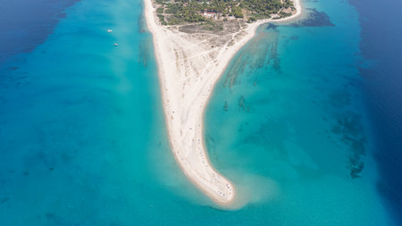 Aerial view of Possidi cape, a narrow strip of land extending into the Aegean sea with white sand and turquoise water, located in Kassandra, Halkidiki, Greeceの写真素材