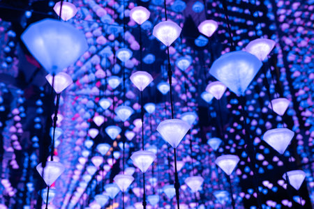 LED lights hanging diamond shaped from ceiling, casting magical blue and purple glow, transforming indoor space with enchanting illuminationの写真素材