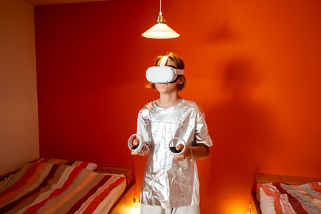 Child immersed in a virtual reality experience, wearing a VR headset and using controllers while...