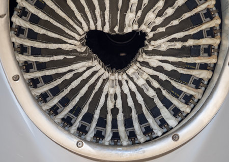 Close-up of turboprop engine exhaust with visible internal structure and protective fabric elements...