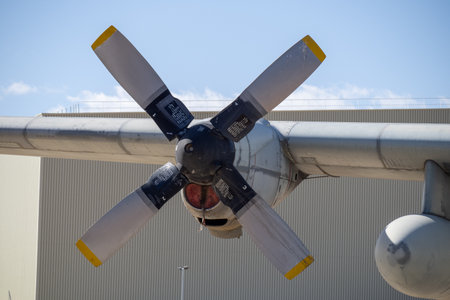Detailed front view of propeller hub and blades on preserved retired aircraft shown as static...