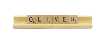 Miami, FL 4-18-24 popular baby boy first name of OLIVER made with square wooden tile English alphabet letters with natural color and grain on a wood rack holder isolated on white backgroundの写真素材