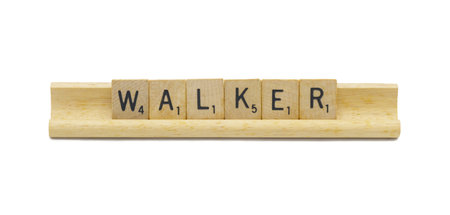 Miami, FL 4-18-24 popular baby boy first name of WALKER made with square wooden tile English alphabet letters with natural color and grain on a wood rack holder isolated on white backgroundの写真素材