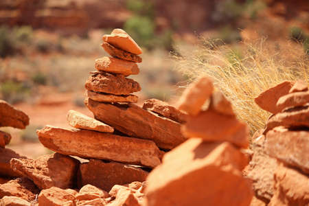Rock cairns constructed by hikers in the desert.の写真素材