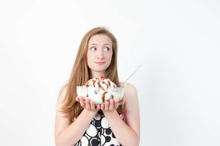 Part of a series of facial expressions as the girl weighs out her choice.の写真素材