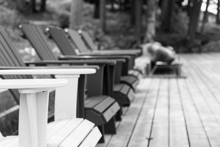 Front row seats on the dock at the lake offer a place for reflection, relaxation and conversationの写真素材
