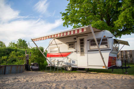 A vintage trailer parked on a rural campsite.. No People.の写真素材