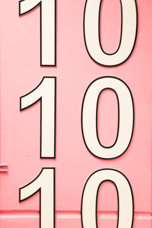 number ten multiple times on pink wall