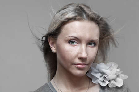 dramatic portrait of a woman with flying hairの写真素材
