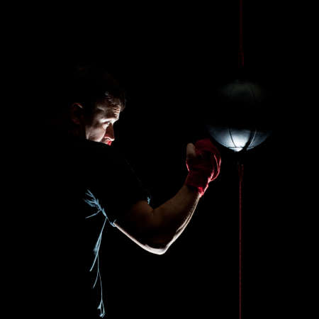 boxer training on black background