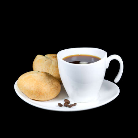 cup of coffee with rolls on black backgroundの写真素材