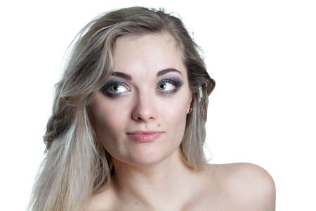 head portrait of a young woman looking at somebody on white backgroundの写真素材