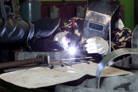 welding operator with co-workerの写真素材
