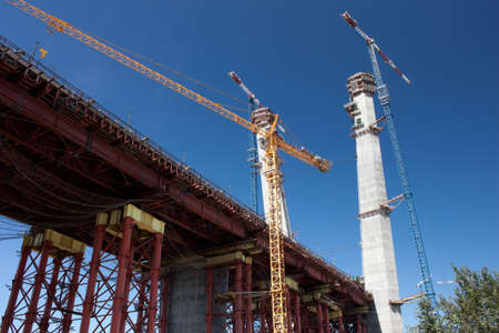 constructing of cable bridge view against deep blue sky  の写真素材