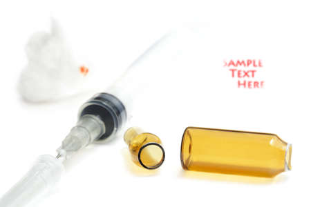 Used syringe and empty opened ampule after injection の写真素材